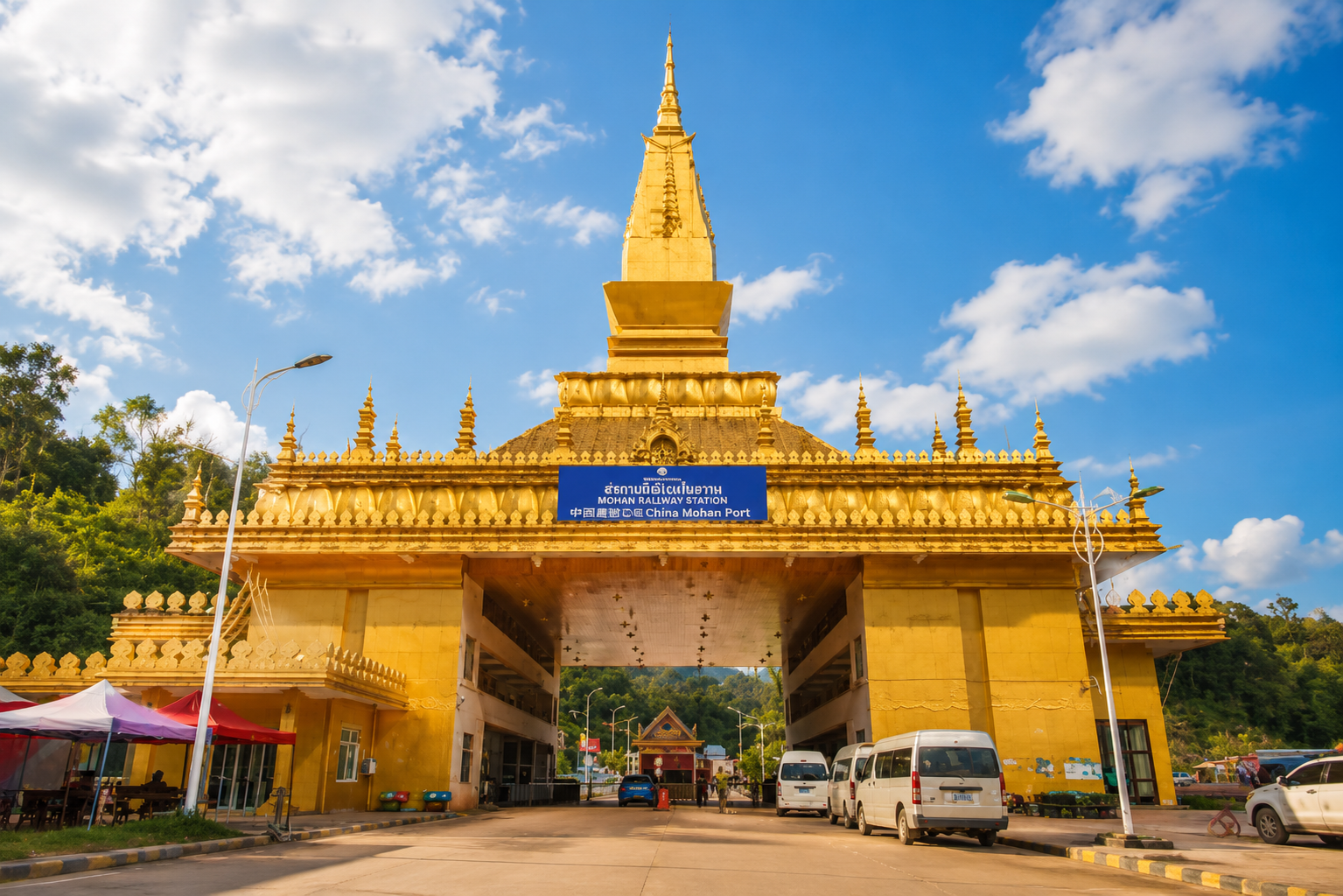 The golden China Mohan Port gate on the Chinese side of the Boten–Mohan border crossing
